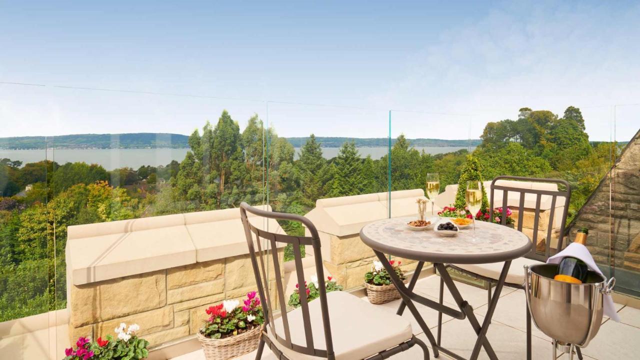 The Culloden Estate And Spa Холивуд Екстериор снимка A view of the lake from the balcony of a house in the village